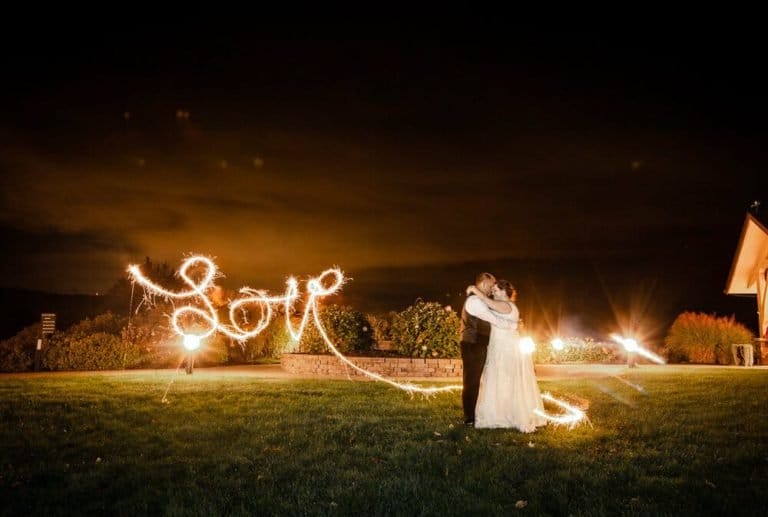 Fall Wedding with love sign at night