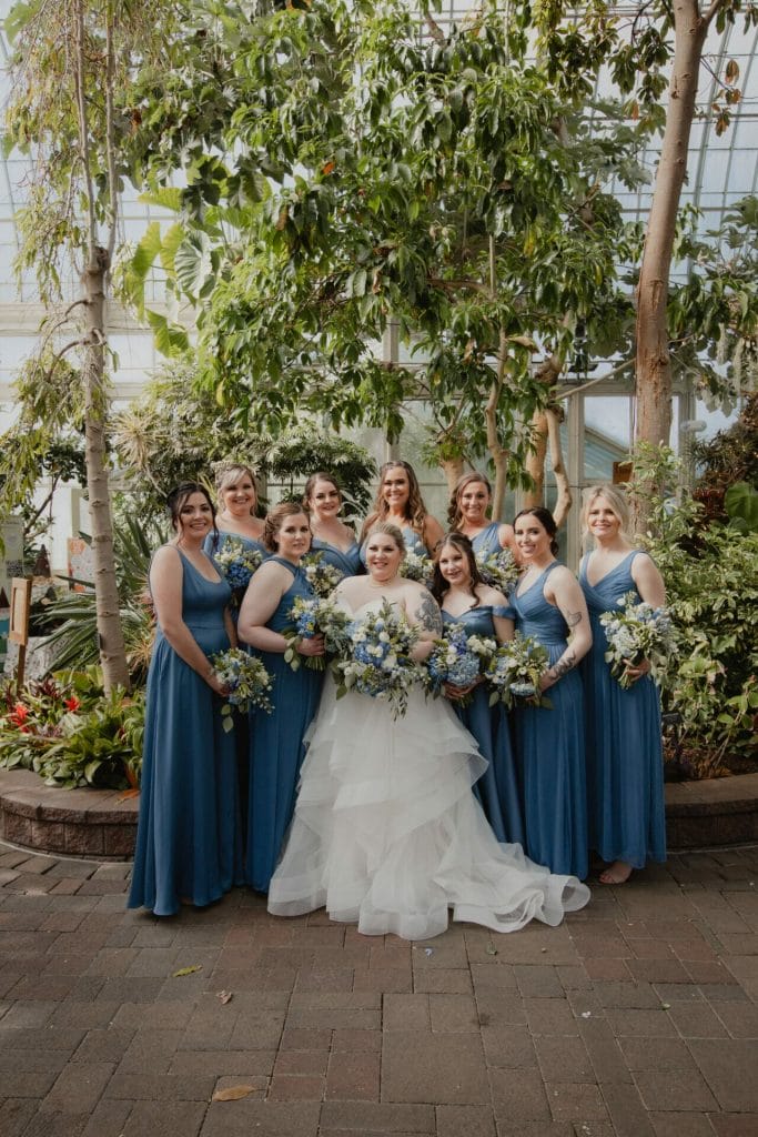 bride's maids and bride pose botanical gardens