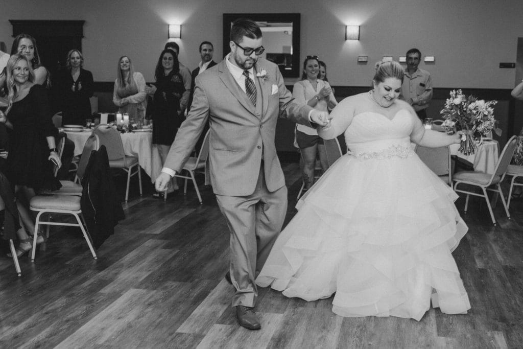 groom and bride dance greyscale