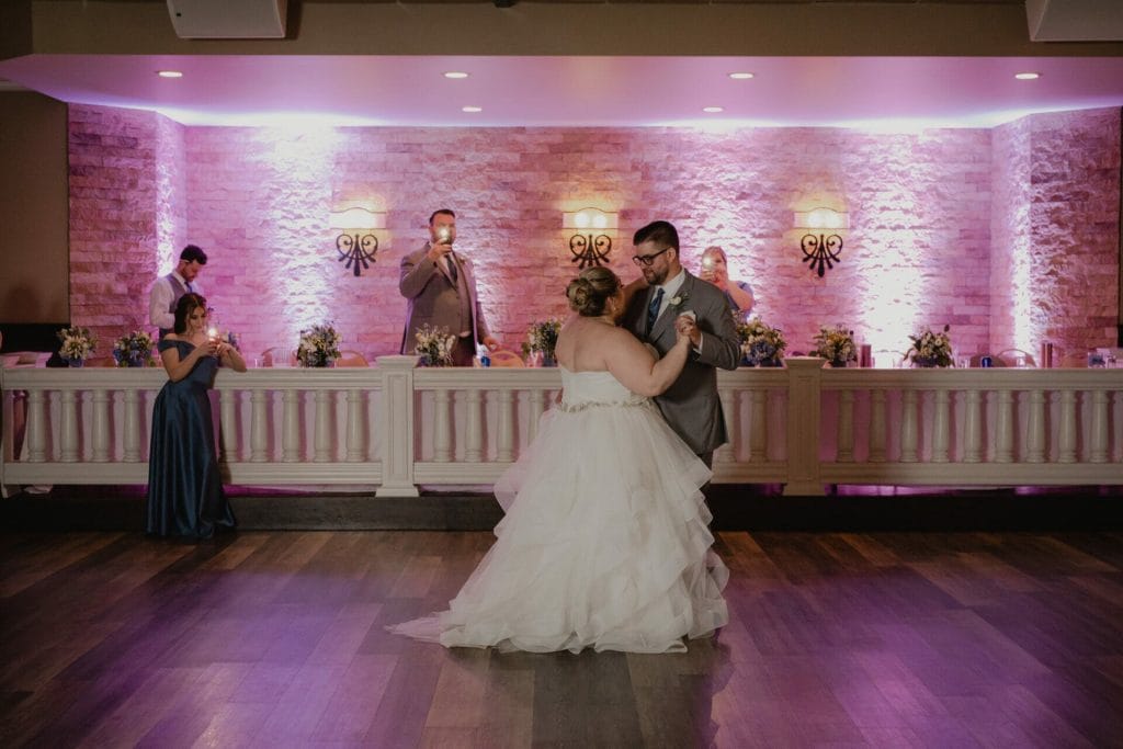groom and bride dance in dining hall