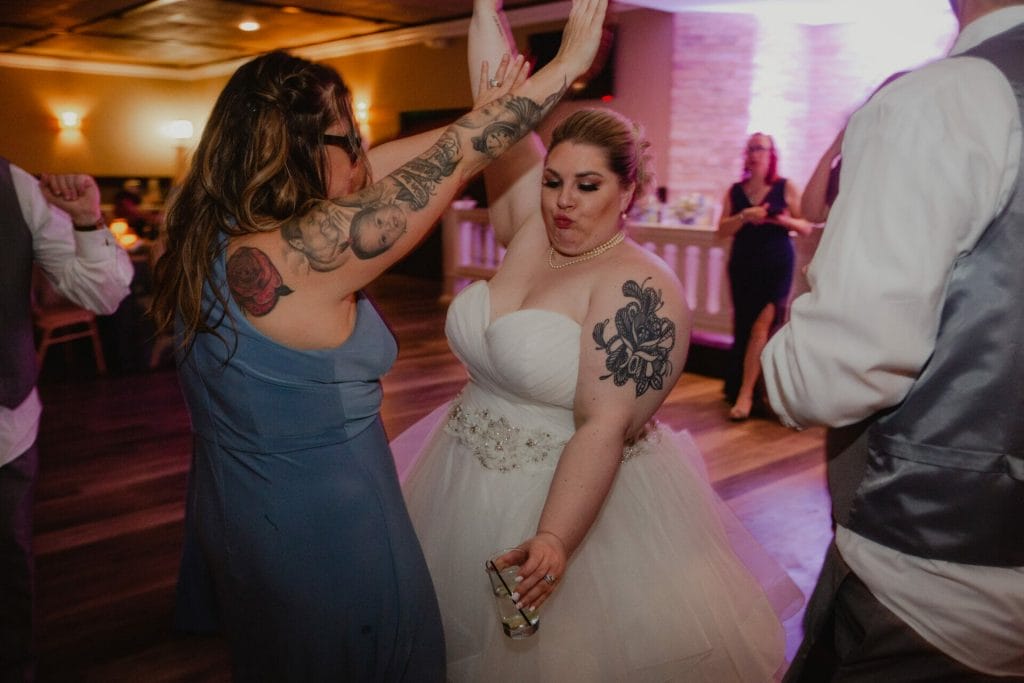 bride dances with brides maid